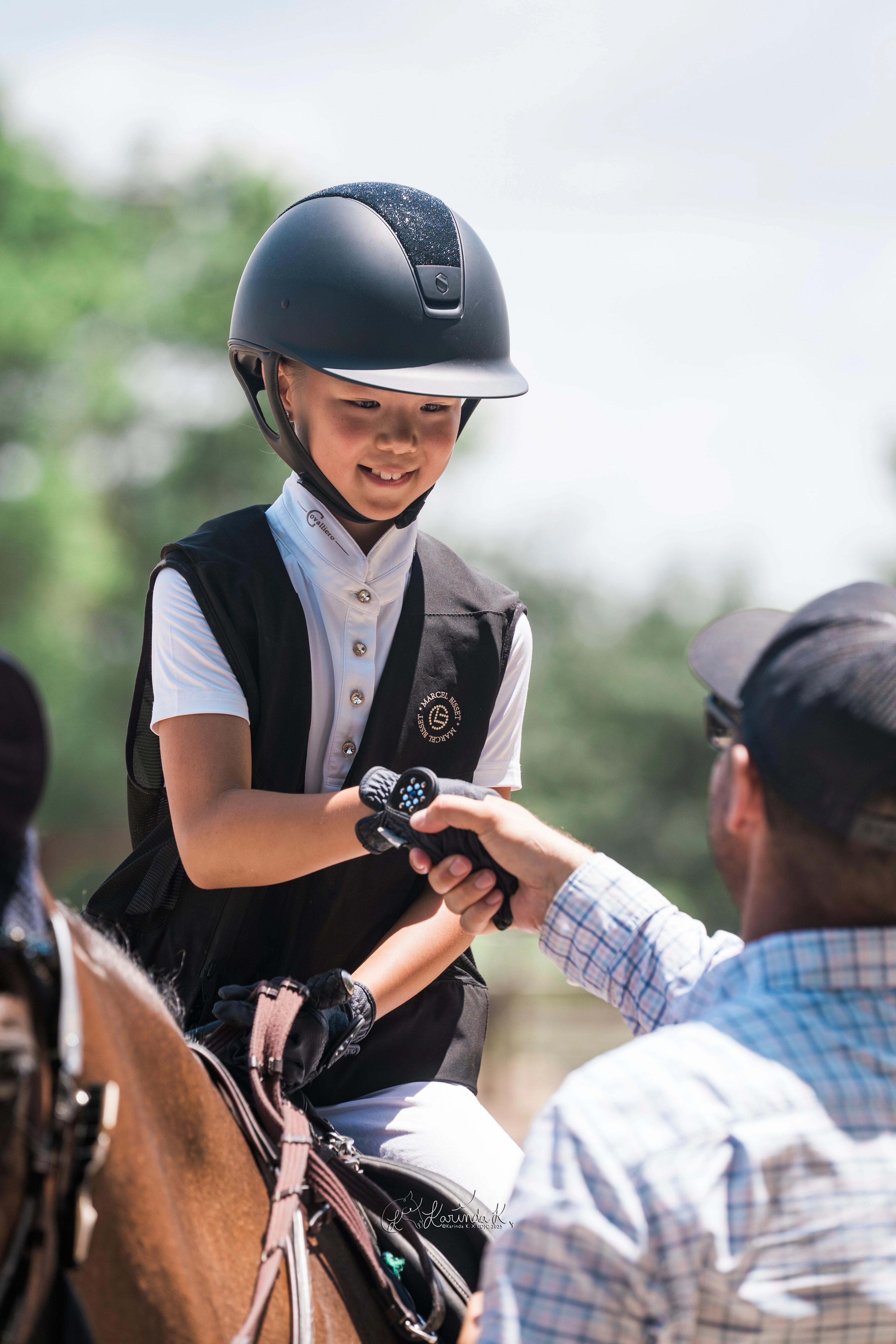 A young UDJC rider receiving recognition while mounted